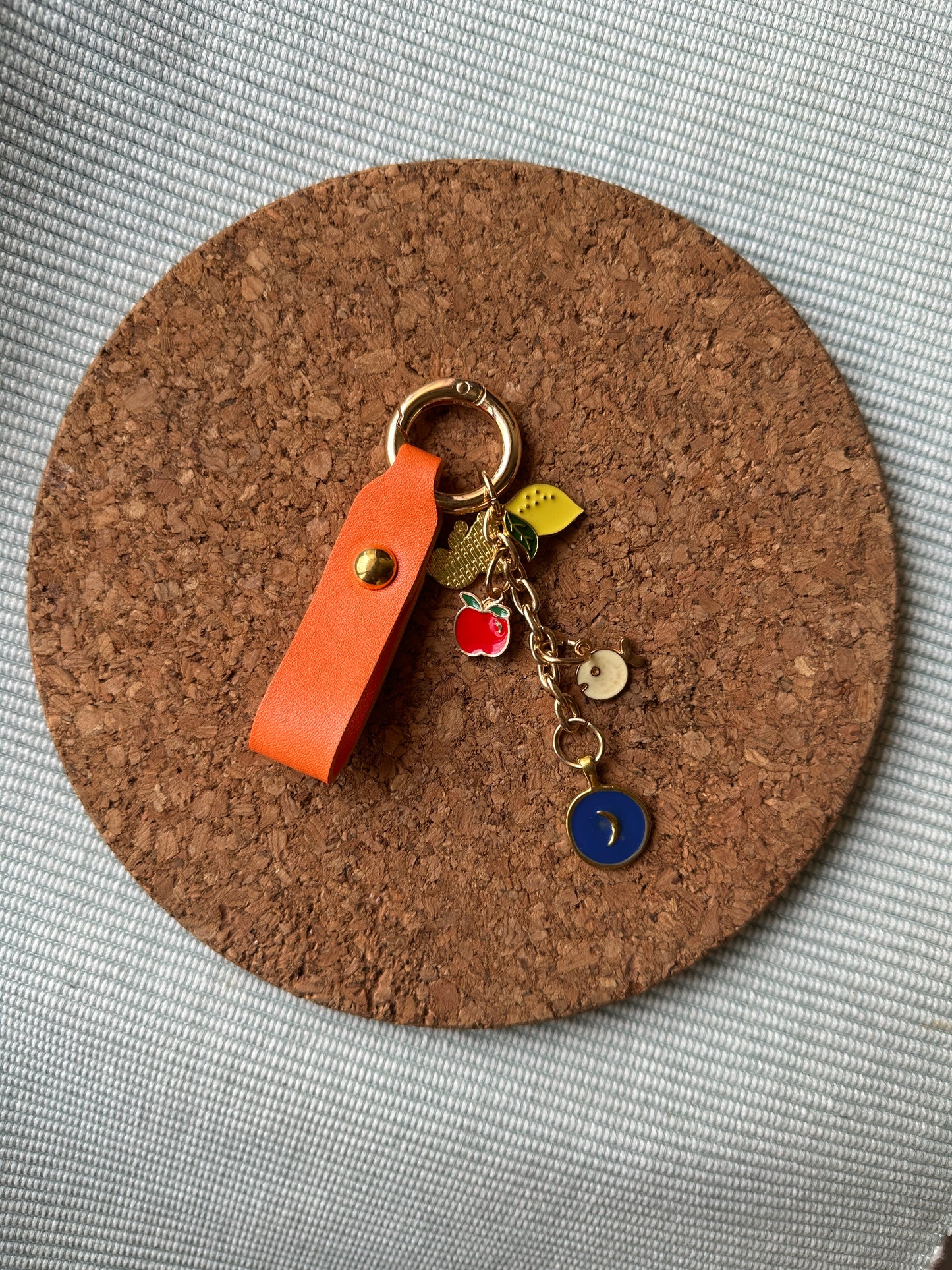 ORANGE KEYCHAIN WITH CHARMS