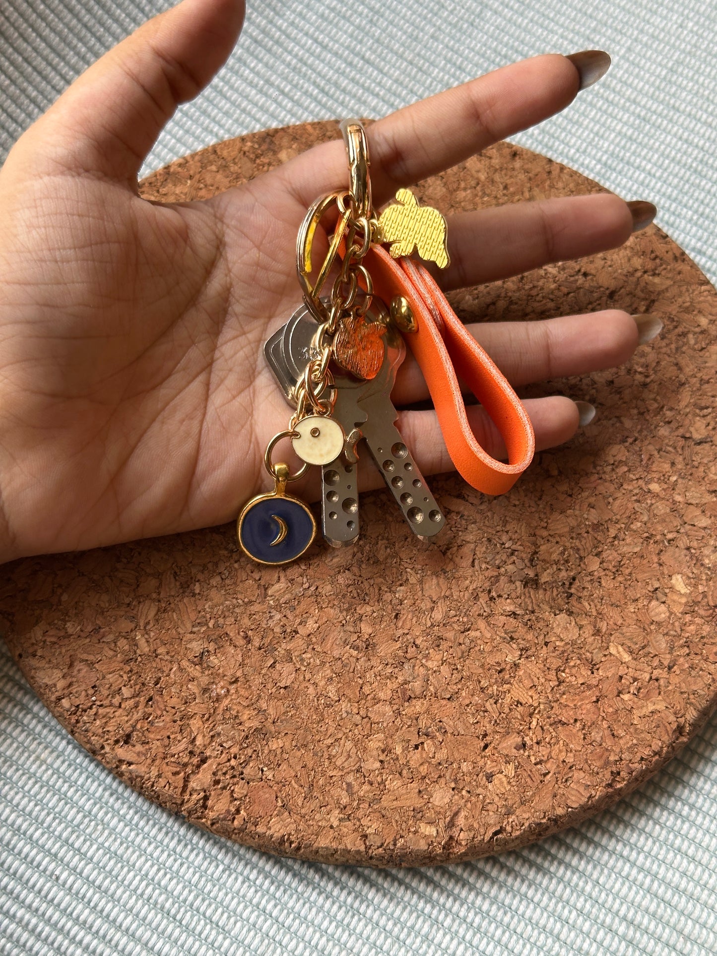 ORANGE KEYCHAIN WITH CHARMS